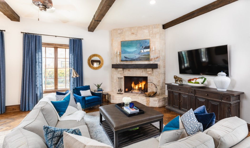 Elegant living room with stone fireplace, part of a Dallas interior design project.